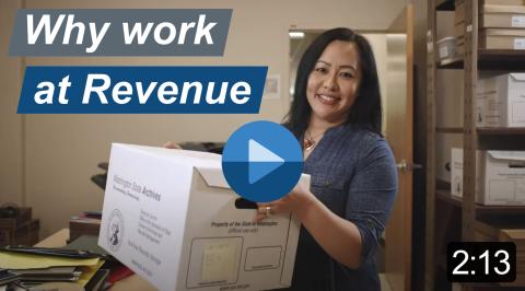 Video with the title "Why work at Revenue" is 2 minutes and 13 seconds long. Smiling, dark-haired woman holding a box of files.